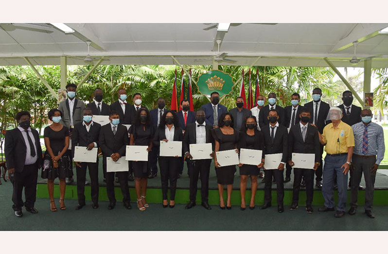 President, Dr. Irfaan Ali (centre, second row) with Housing and Water Minister, Collin Croal (sixth right) and senior members of the Guyana Lands and Survey Commission and the newly sworn-in land surveyors