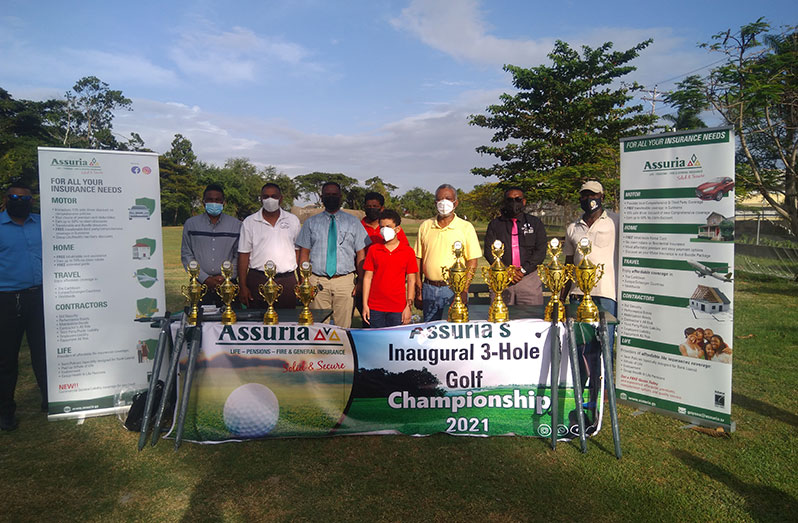 Former Prime Minister Samuel Hinds, his grandson Marcus, Assuria General Manager Yogindra Arjun as well as GGA president Aleem Hussain and other executives at the launch of the Assuria 3-Hole Golf Championship
