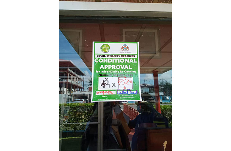 The sign indicating approval for indoor dining (Guyana Tourism Authority photo)
