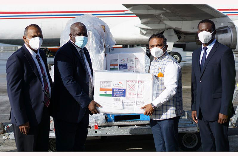 Flashback! Prime Minister of Guyana, Brigadier (ret’d), Mark Phillips (second left) received the ‘Covishield’ Oxford-AstraZeneca vaccines donated by the Government of India from the High Commissioner of India to Guyana, Dr. K. J. Srinivasa (second right). Also in the photo is Minister of Health, Dr. Frank Anthony (left) and Minister of Foreign Affairs and International Cooperation, Hugh Todd (right) (Elvin Croker photo)