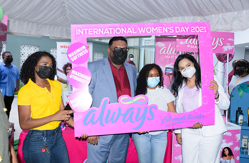 President, Dr. Irfaan Ali and Minister of Human Services and Social Security, Dr. Vindhya Persaud, share a moment with some of the persons who participated in the WE LIFT women empowerment expo (Delano Williams photo)