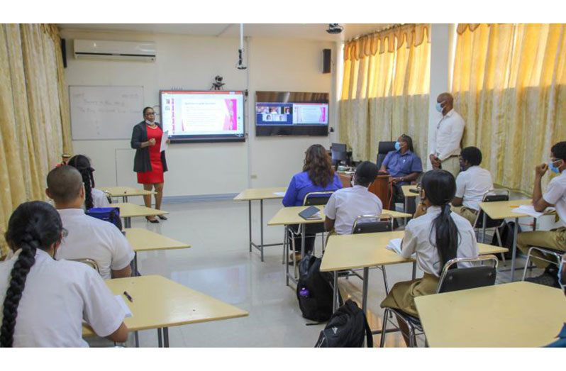 A teacher conducting her lesson in a smart classroom