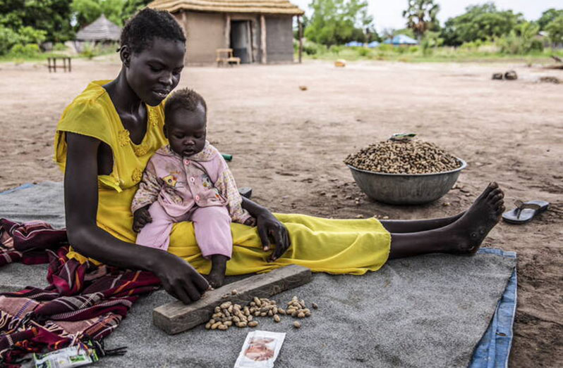 Agong and her child in South Sudan, where over seven million people are projected to fall into crisis or worse levels of acute food insecurity (FAO photo)