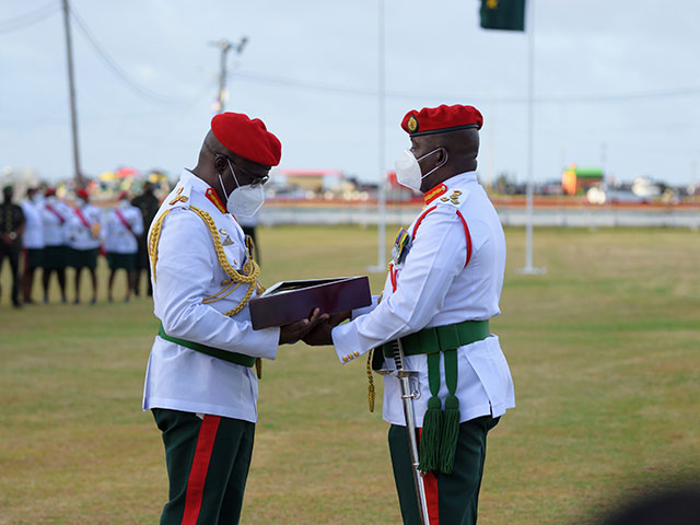 Brigadier Patrick West officially handing over the reins of office to Brigadier Godfrey Bess