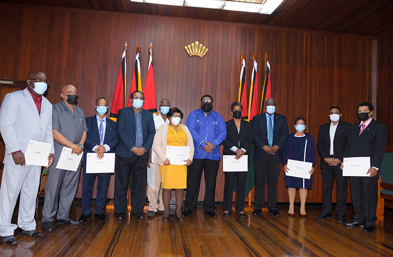 President, Dr. Irfaan Ali (centre); Prime Minister, Brigadier Mark Phillips (fourth from right); Minister of Local Government, Nigel Dharamlall (second from right) and
Minister within the Ministry of Local Government, Anand Persaud (fourth from left), with the newly appointed members of the commission (Delano Williams photo)