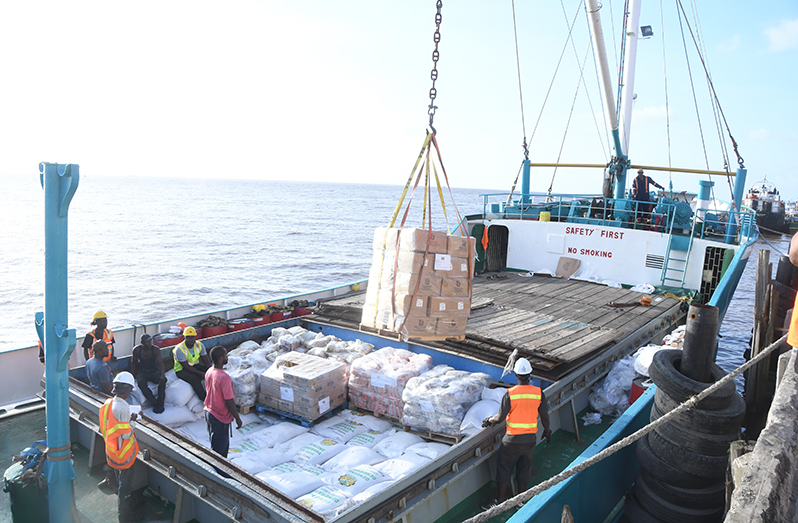 The third shipment of relief supplies destined for St. Vincent and the Grenadines and Barbados being loaded on to the motor vessel (MV) Lady Fazeela at  Muneshwer’s Wharf, Georgetown, on Monday (Adrian Narine photo)