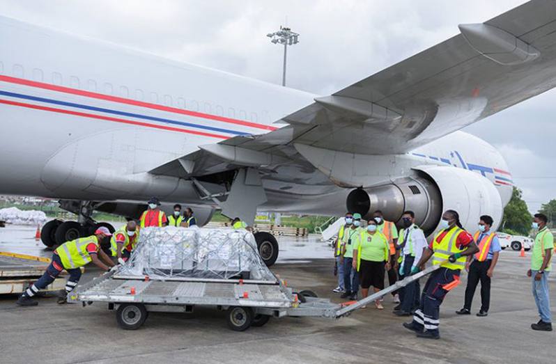 The first batch of the Oxford-AstraZeneca vaccine for COVID-19, made available through the COVAX facility, being offloaded from the AmeriJet International aircraft which arrived, Monday, at 09:40 hours at the Cheddi Jagan International Airport