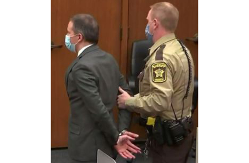 Former Minneapolis police officer, Derek Chauvin, is led away in handcuffs after a jury found him guilty of all charges in his trial for second-degree murder, third-degree murder and second-degree manslaughter in the death of George Floyd in Minneapolis, Minnesota, U.S. April 20, 2021 in a still image from video (Pool via REUTERS)