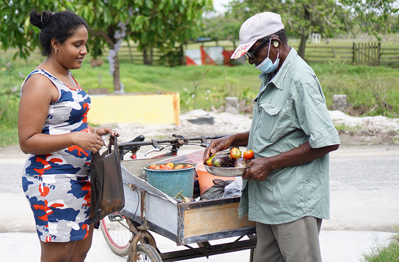 Narine Dookie selling greens in the village