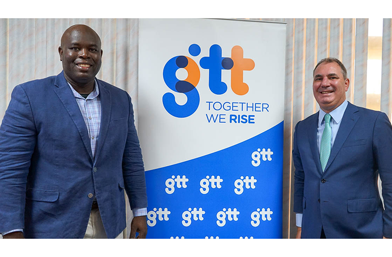 Outgoing CEO of GTT, Justin Nedd (left), with the newly-appointed CEO, Damian Blackburn