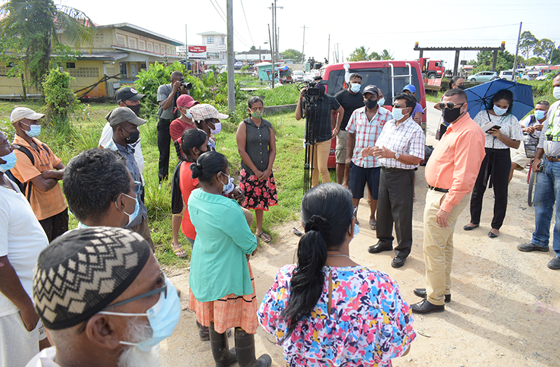 Housing and Water Minister, Collin Croal and GWI CEO, Shaik Baksh, meeting with residents of Parika Backdam and surrounding areas