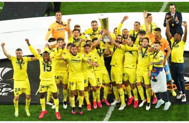 Villarreal players hold up their trophy as they celebrate winning the 2021 UEFA Europa League football final between Spain's Villarreal and England's Manchester United at the Gdansk Stadium in the Polish city of Gdansk Wednesday. (Photo: AFP)