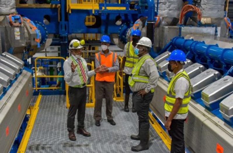 Prime Minister Brigadier (Ret’d) Mark Phillips being briefed during an on-site inspection on Monday of the 46.5-megawatt power generation plant being constructed by Wärtsilä at the Guyana Power and Light (GPL)’s Garden of Eden Power Station (DPI photo)