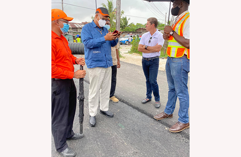 Minister of Public Works, Bishop Juan Edghill meeting with proprietor of Vieira 66 Logistics, Mark Viera, at the site of the ongoing works at Hunter Street, Alexander Village, on Tuesday