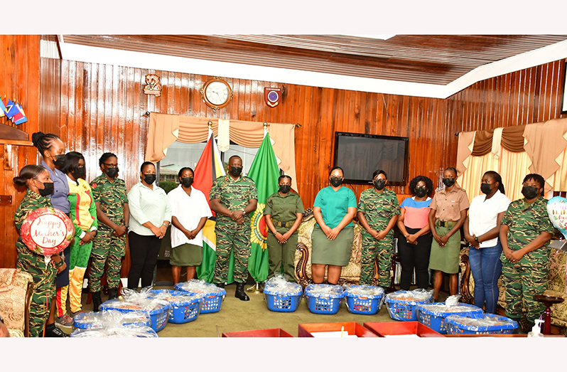 Chief-of-Staff, Brigadier Godfrey Bess (centre) flanked by ranks who benefitted from Mothers’ Day hampers