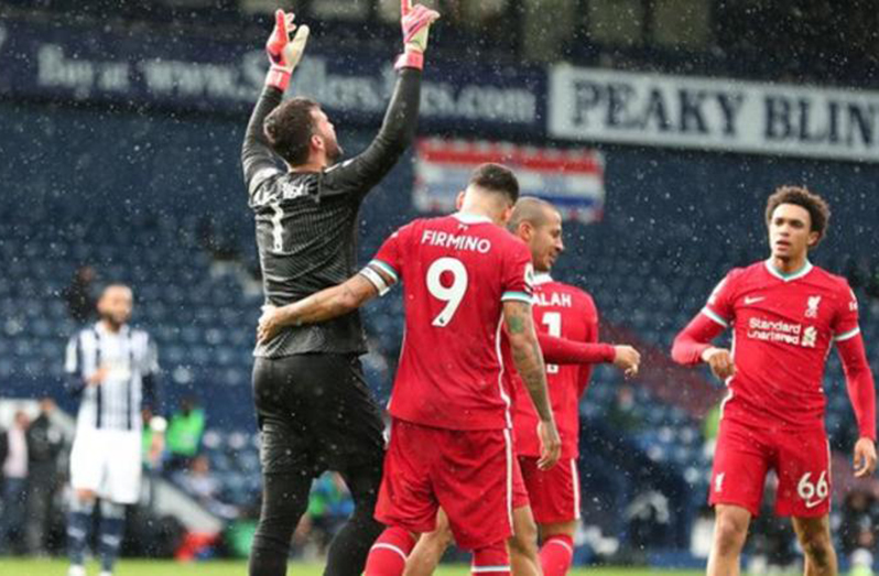 Alisson looks up to the sky immediately after scoring the winner at The Hawthorns.