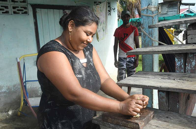 A resident of Bath Settlement, West Coast Berbice, shows off her skill at using a piece of the ‘lorha and sill’ she inherited from her family