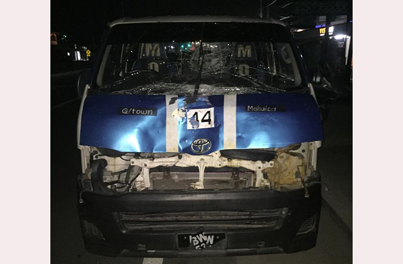 A view of the route 44 minibus from the front, displaying damage consistent with the accident