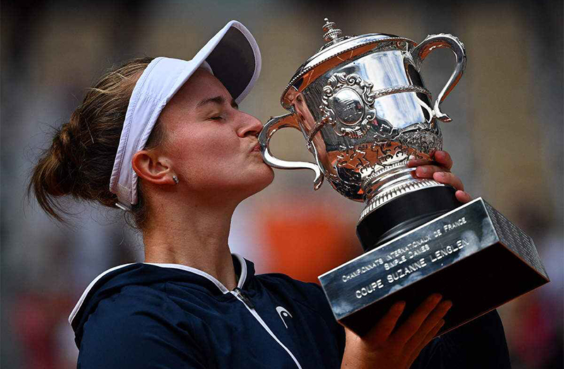 Czech Republic's Barbora Krejcikova kisses and celebrates with the Suzanne Lenglen Cup. (AFP Photo)