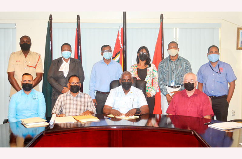 Minister of Home Affairs, Robeson Benn (seated third left) and members of the Fire Advisory Board (Elvin Croker photo)
