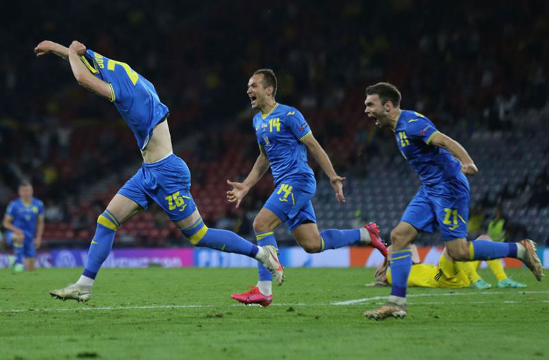 Ukraine’s Artem Dovbyk celebrates scoring their second goal.