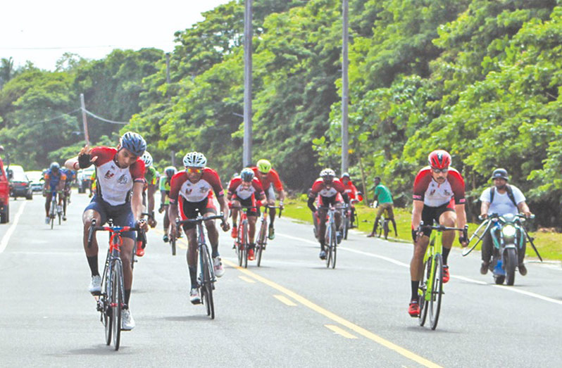 Christopher Griffith (left) about to cross the finish line on Sunday (Photo: Guyana Cycling News Facebook)