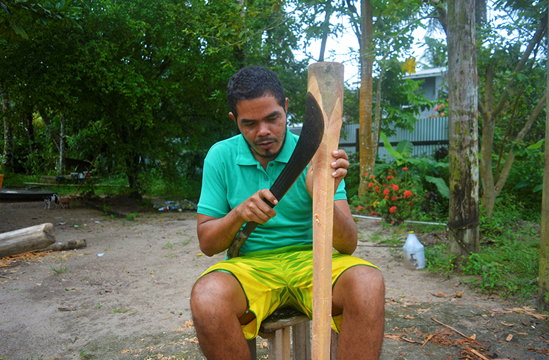 Alin Crighton as he was shaping the wood into an axe handle (Carl Croker photos)