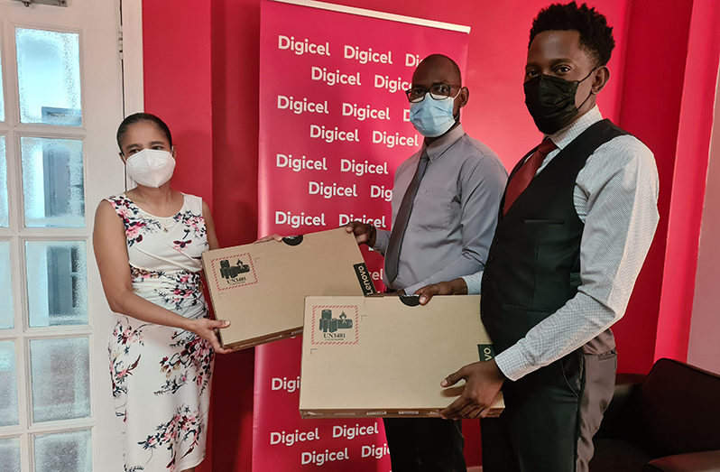 Coordinator of the Sophia Community Development Association, Orin Nelson (centre), and programme director, Leroy Adolphus (left), accept the donation from Digicel’s Chief Commercial Officer, Simone Pierre