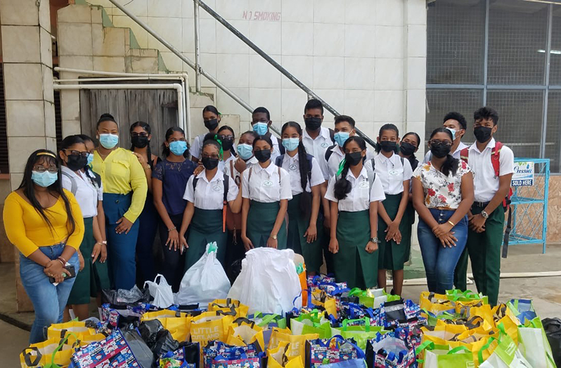 Students and teachers with the food hampers