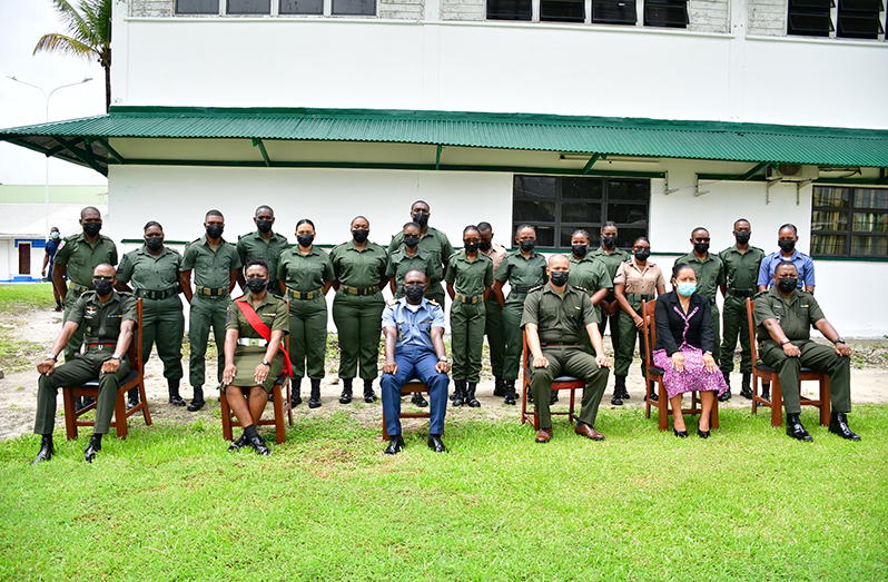 Senior Officers (seated) with the 17 Other Ranks who completed the GDF administrative professional course