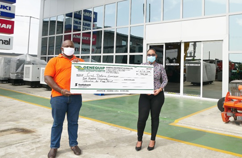 Marketing Coordinator of Genequip, Monique Tiwari, presented a cheque for $500,000 to Captain Michael Andrews of the CDC to support the flood relief efforts, countrywide