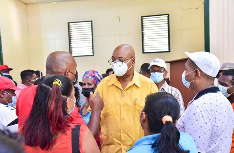 Minister of Public Works, Juan Edghill, listens to the concerns of residents