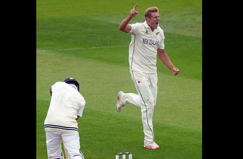 New Zealand’s Kyle Jamieson celebrates the wicket of Rohit Sharma. (Adam Davy/PA).