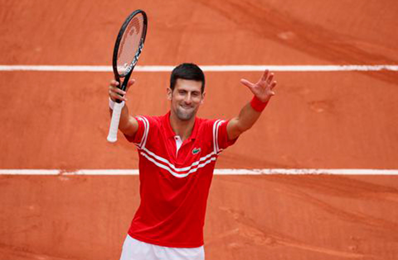 Serbia's Novak Djokovic celebrates after winning his third round match against Lithuania's Ricardas Berankis. (REUTERS/Gonzalo Fuentes)
