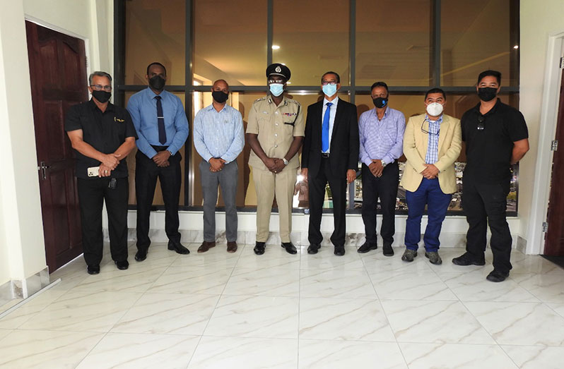 Commissioner of Police (ag) Nigel Hoppie and others share a light moment during the Private Sector Commission (PSC)’s visit to the Guyana Police Force’s Security Command Centre