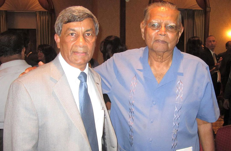 The late Pandit Ramlall (right) with Ashook Ramsaran