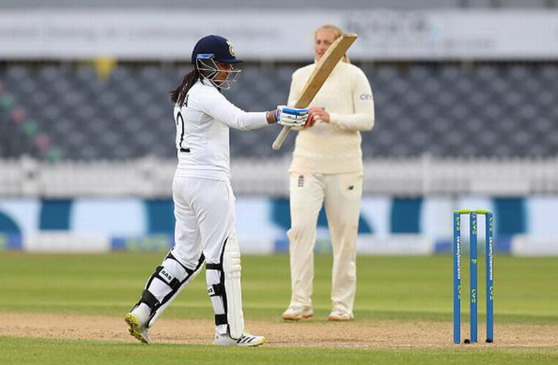 Sneh Rana raises her bat after reaching her half-century on debut against England Women in Bristol. (Getty Images)