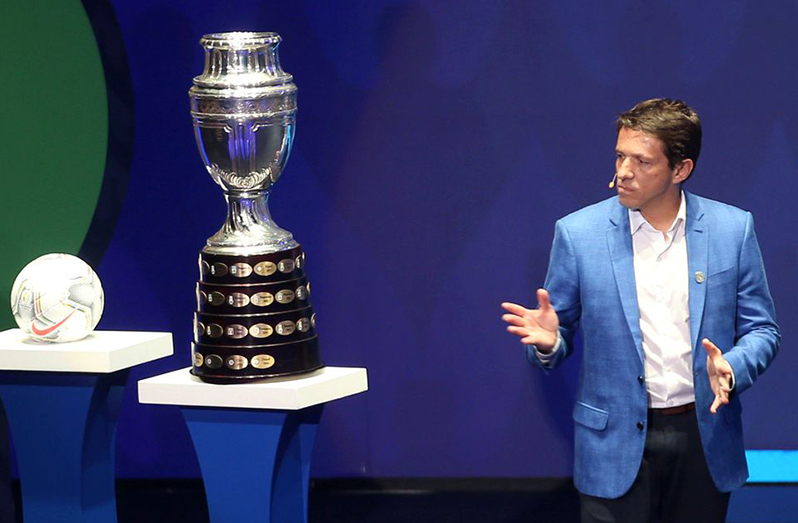 Former Brazil player Juninho with the Copa America trophy and the tournament ball during the tournament draw at Centro de Convenciones in Cartagena, Colombia, on Dec ember 3, 2019. (File photo: Reuters/Luisa Gonzalez)