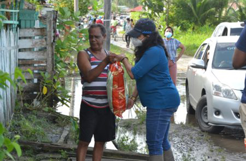 Human Services and Social Security Minister, Dr. Vindhya Persaud distributes food hampers in Region Three