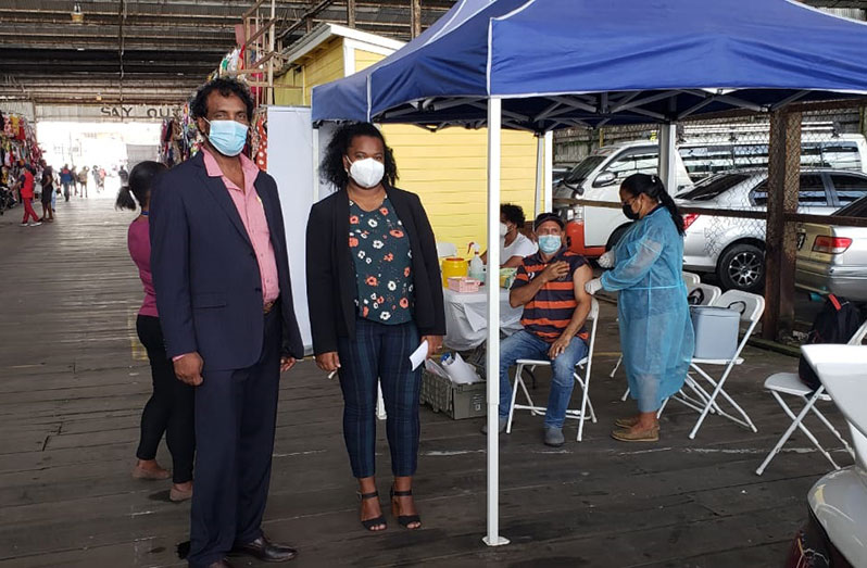 Region Three COVID-19 Task Force Coordinator, Halim Khan and Regional Health Officer (RHO), Region Three, Dr. Erica Forte at the Vreed-en-Hoop Stelling vaccination site