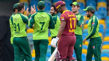 Hasan Ali (3rdL), Shareen Afridi (2ndR) and Shadab Khan (R) of Pakistan celebrate the dismissal of Evin Lewis (4thL) of West Indies during the 1st T20I between West Indies and Pakistan at Kensington Oval, Bridgetown, Barbados, on July 28, 2021. (Photo by Randy Brooks / AFP) (Photo by RANDY BROOKS/AFP via Getty Images)