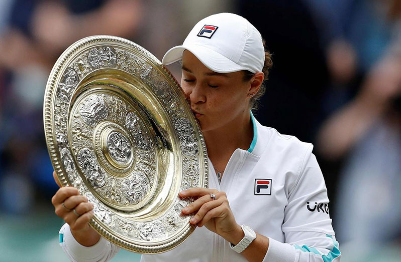 Australia's Ashleigh Barty holds the trophy after winning her final match against Czech Republic's Karolina Pliskova at All England Lawn Tennis and Croquet Club, London, Britain. (REUTERS/Toby Melville)