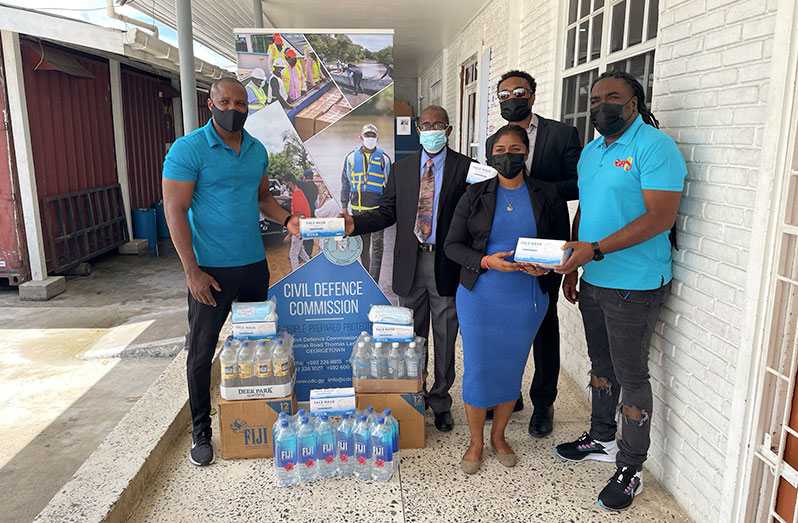 From left to right: Deputy Director-General of the CDC, Major Loring Benons; Chairman of The Green Path Foundation, Charles Griffith; CEO of Lomam Group Inc., Calvin Wright; Branch Manager of The Green Path Foundation, Gaitri Singh, and CEO of Hits and Jams Entertainment, Rawle Ferguson, are pictured with some of the donated items