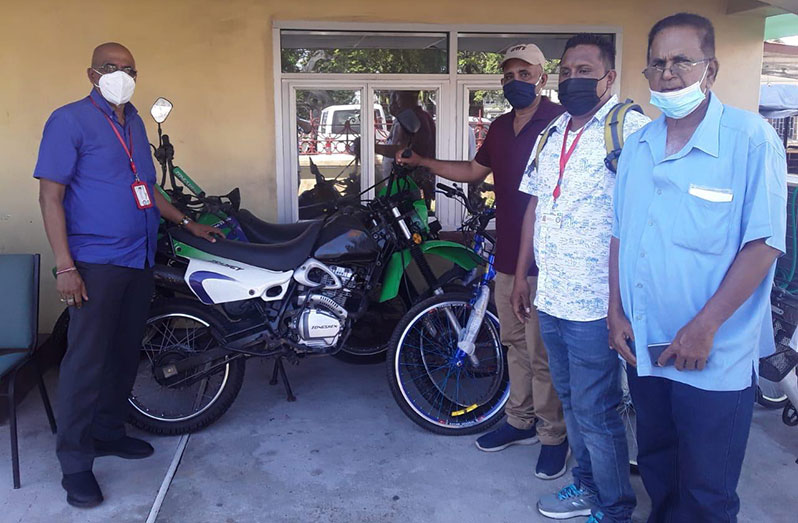 Administrator of the Ministry of Home Affairs’ Community Policing Groups (CPG), Rishi Das and others during the handing over of the equipment  last Friday