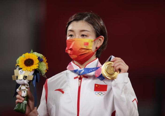 Chen keeps China's perfect table tennis record intact with ...