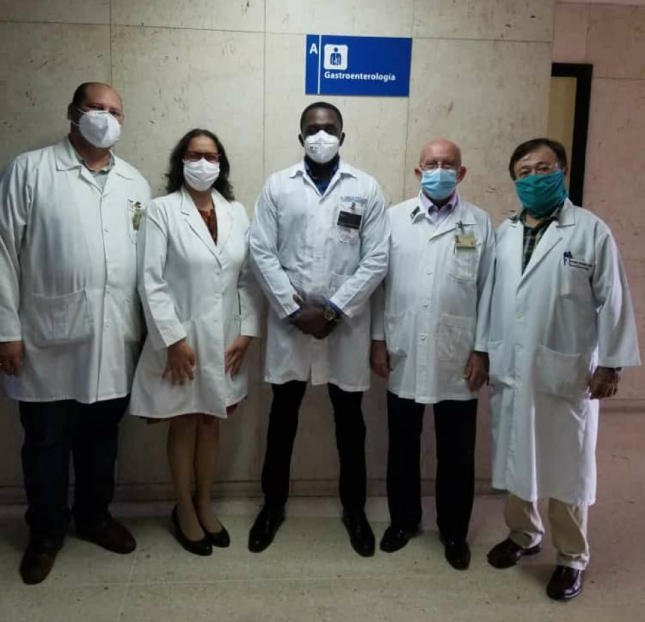 At a health facility in Cuba are, from left:  Drs. Jordi Alonso; Marlen Ivon Castellanos Fernandez; Adrian Van Hooten; Juan Antonio Mas Paez; and Hermedio Hernandez Mulet, at a facility in Cuba
