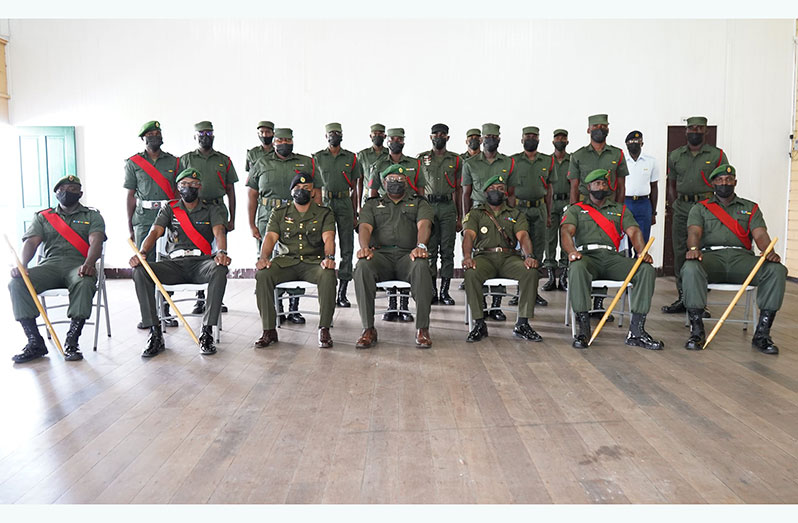The 15 Non-Commissioned Officers (standing in rear) with senior ranks (seated) before the commencement of the course on Friday
