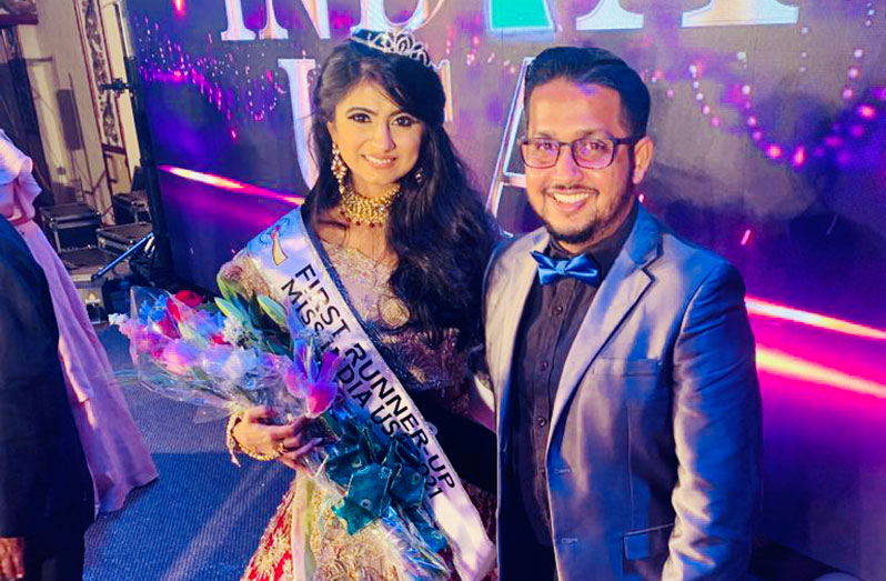 Hashim Ali poses with one of the runners-up for the Miss India USA Competition