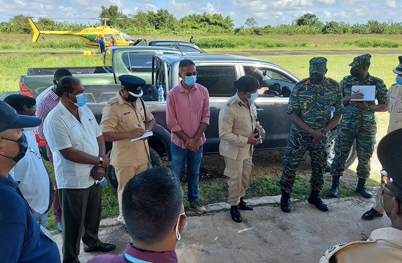 Deputy Commissioner Hicken (fourth from left) speaks to other senior officers at the stakeholders’ meeting in Orealla