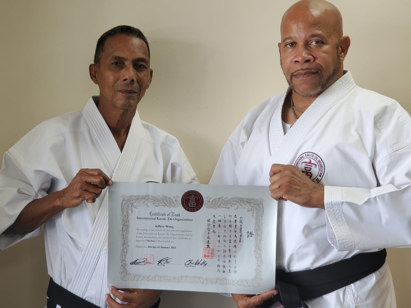 Shihan Jeffrey Wong (Left) receiving certificate from Shihan Adrian Ellis (Right)